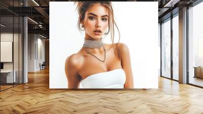 Model girl in a trendy crop top with a statement necklace on a white background. Wall mural