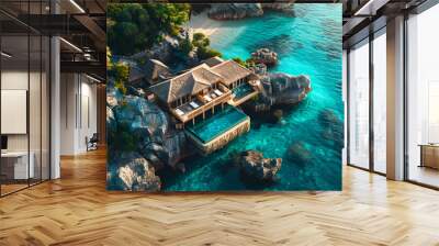 Aerial drone above view of luxury resort hotel villa building with swimming pool on sea or ocean water coast with rocks and cliffs on shore Wall mural