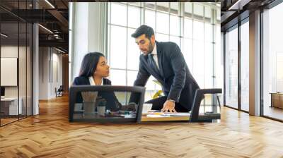 mixed race standing businessman and  colleague presented the project idea in the office  by teleconference online during social distancing work from home Wall mural