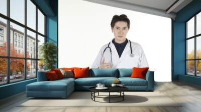 the young asian medical doctor and his stethoscope at isolated white background copy space  Wall mural