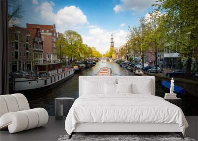 Amsterdam canal with cruise ship with Netherlands traditional house in Amsterdam, Netherlands. Landscape and culture travel, or historical building and sightseeing concept. Wall mural