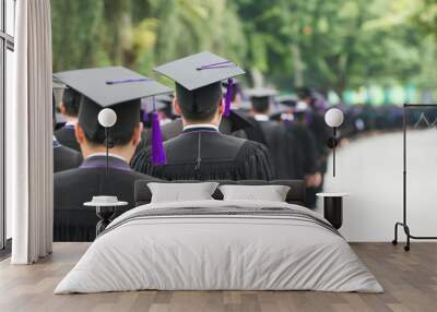 Back of graduates during commencement at university. Graduate walking. Wall mural