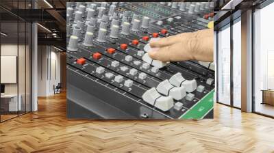 Finger pushing a mixing desk slide. Selective focus Wall mural