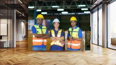 group of asian smiling warehouse worker standing together at logistics distribution warehouse, teamw Wall mural