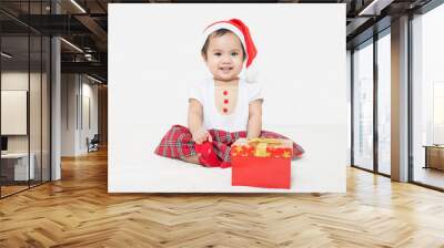 Photo of curious and surprised asian baby in Santa cap looking a Wall mural