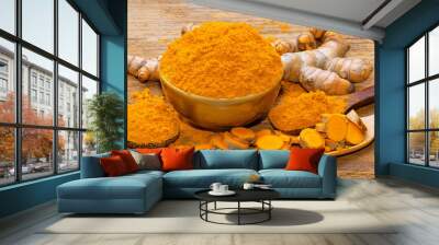 fresh turmeric roots on wooden table Wall mural