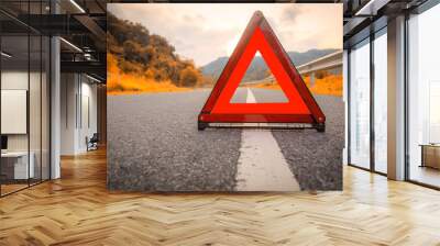 Autumn road Red triangle, red emergency stop sign, red emergency symbol on road. With copy space for text or design Wall mural