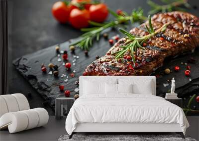 The image shows a grilled beef steak with spices on a knife on a stone background with space for your text. Wall mural