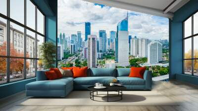 Aerial View of Jakarta Downtown Skyline with High-Rise Buildings With White Clouds and Blue Sky, Indonesia, Asia Wall mural