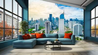 Aerial View of Jakarta Downtown Skyline with High-Rise Buildings With White Clouds and Blue Sky, Indonesia, Asia Wall mural