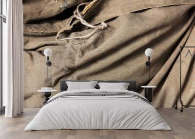 Khaki folds texture. Natural canvas material from the Second World War. Wall mural