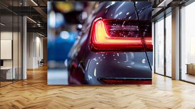 closeup of a red taillight on a modern car, detail on the rear light of a car Wall mural