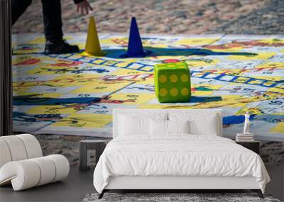 people outdoors on a sunny day on the pavement playing an enlarged board game Wall mural