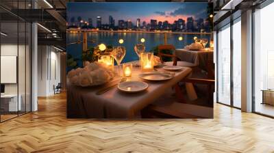 Amazing romantic dinner in a luxury hotel with candles under the sunset sky. Romance and love, luxurious restaurants, exotic table setting overlooking the sea Wall mural