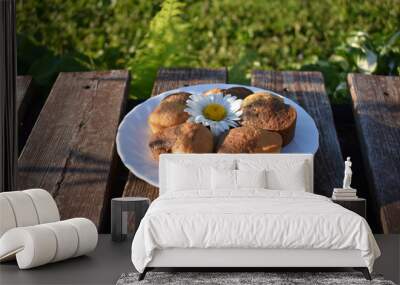 Cupcakes on the background of nature. Wall mural