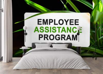 Employee Assistance Program text on white surrounded by green leaves Wall mural