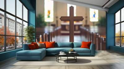 Wooden cross in focus inside a church with stained glass windows in the background, empty pews
Christian cross, church interior, empty pews, stained glass windows Wall mural