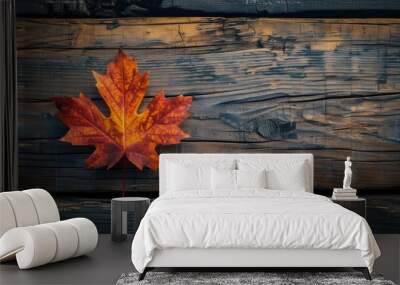 Autumn maple leaf on wooden surface with copy space Wall mural