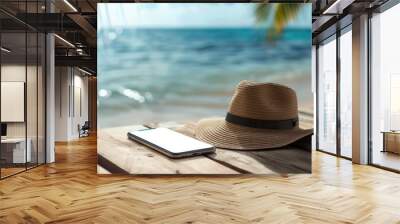 Close up of phone and hat on wooden beach terrace background with mockup tech display Wall mural