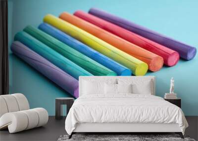 Colorful drawing chalk set on cyan background with clipping path Wall mural