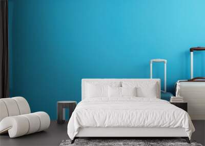 Empty blue room with one suitcase ready for travel Wall mural