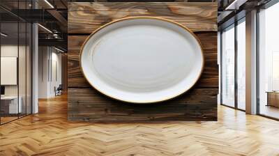 Empty oval plate on wooden surface seen from above with space for text Wall mural