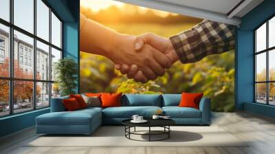 Farmers collaborating for sustainable support through farming, agriculture, and a handshake symbolizing trust, teamwork, and growth in a b2b deal, partnership, or agreement on an agro farm. Wall mural