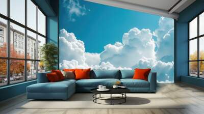 Fluffy white clouds under a blue sky Wall mural