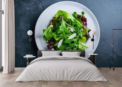 Fresh green salad served on a pristine white plate Wall mural