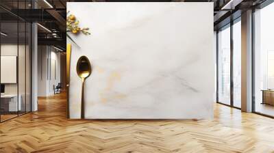 Golden cutlery on a white stone table for Christmas or New Year s with space for a card or menu template Wall mural