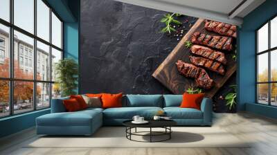 Grilled Denver steak on cutting board with BBQ beef on black background top view with space for text Wall mural