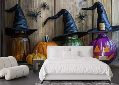 Halloween decorations featuring potion bottles witches hats pumpkins and gourds on wooden planks Wall mural