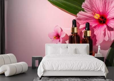 Hibiscus extract serum or oil in two amber dropper bottles on pink background with copy space Wall mural