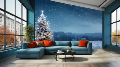 The snow covered Christmas tree contrasts with the dark blue backdrop Wall mural