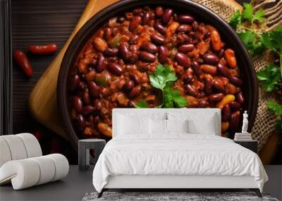 Top view of homemade vegan vegetarian stew with kidney beans and vegetables on a wooden table Wall mural