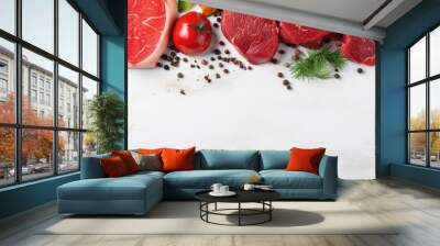 Top view of organic food a banner with raw meat including steak salmon beef and chicken displayed on a white wooden background Wall mural