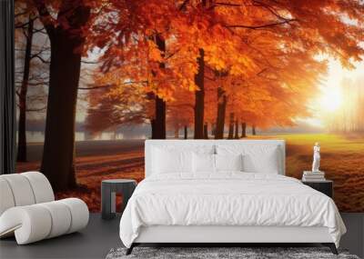 Vibrant trees in an autumn park, with sunlight gleaming through the leaves. Wall mural