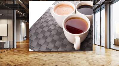 Hot beverages of chocolate, tea and black coffee on woven place  Wall mural