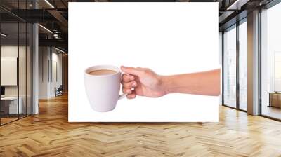 Woman hand holding a mug of coffee with creamer  Wall mural