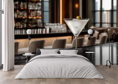 A classic martini with an olive sits elegantly on bar counter, showcasing sophistication Wall mural