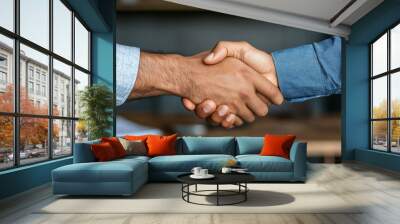 Building trust through firm handshake in professional setting Wall mural