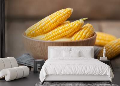 Fresh corn on cob in wooden bowl, showcasing vibrant yellow kernels Wall mural