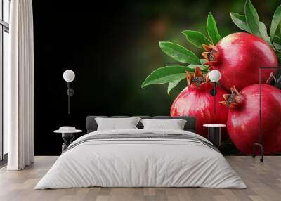 Fresh pomegranate fruits hanging on branches, showcasing vibrant colors and lush leaves Wall mural