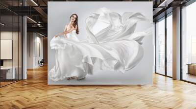 beautiful young girl in flying white dress. Flowing fabric Wall mural