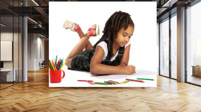 cheerful girl draws pencil lying on the floor Wall mural