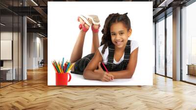 cheerful girl draws pencil lying on the floor Wall mural