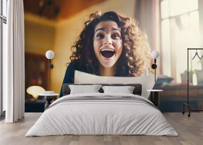 A happy young girl rejoices at a letter from an educational institution about admission. Wall mural