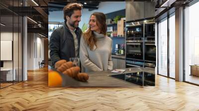 A man and a woman choose furniture in a showroom. Wall mural