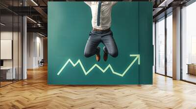 Energetic Business Professional Leaps Joyfully on Trampoline As Stock Market Shows Positive Trends Wall mural