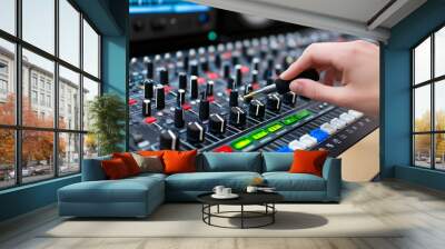 Podcaster fine-tuning audio levels in a vibrant studio setting during recording Wall mural